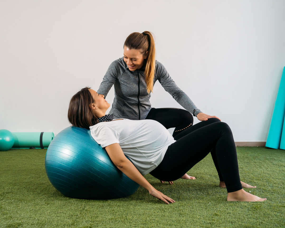 coach working with pregnant woman