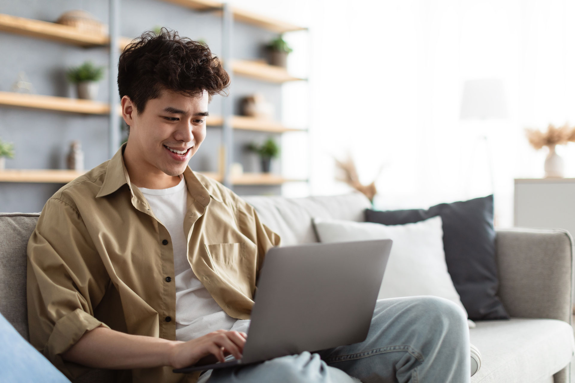 teenage boy using laptop